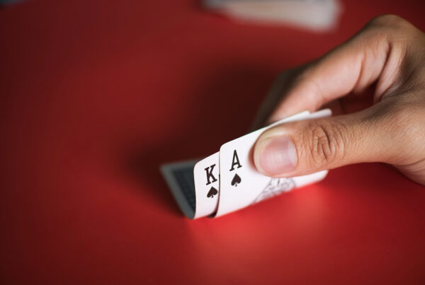 blackjack cards hands red table